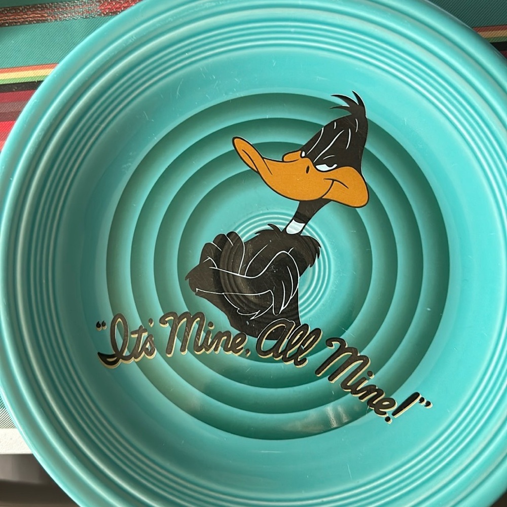 Set a four Warner Brothers Daffy duck plates made by Fiestaware 1994